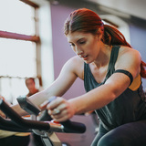 A woman cycles in spin class at Iowa State University