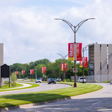Street view of University Boulevard and two sides of the bridge