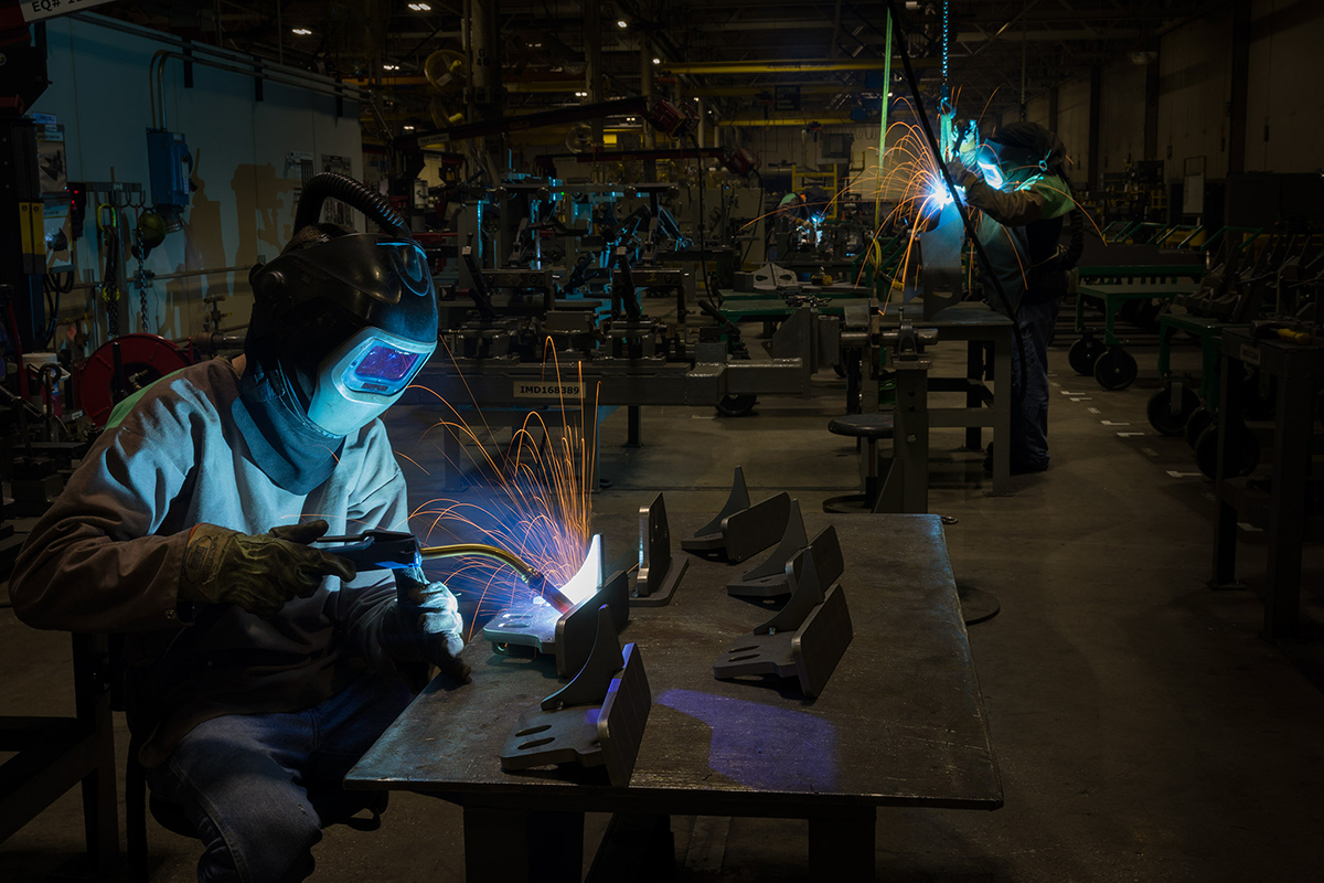 Welders assemble parts at John Deere's Davenport Works facility in Davenport, Iowa. Photo courtesy of John Deere.