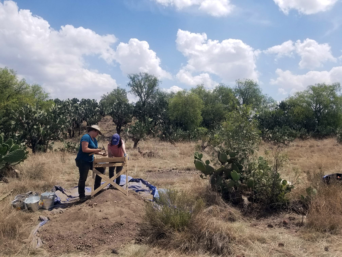 Feben Ruscitti, a senior majoring in anthropology and classical studies, and Serena Webster, a graduate student in anthropology, sift through dirt to recover any missed artifacts from the excavation site at Teotihuacan, Mexico in July 2022.