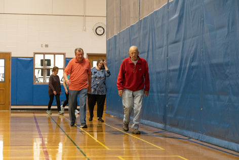 Participants in Walk with Ease walk at the Ames Park and Recreation Community Center in March, 2022. Photo by Laurel Feakes/Iowa State University