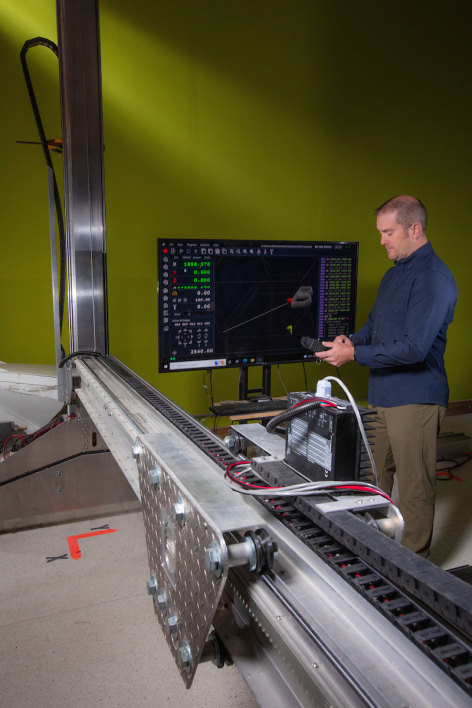 Pete Evans, assistant professor of industrial design, works with a 3D printer at Iowa State.
