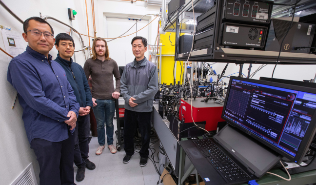 Jigang Wang and his research group with the extreme-scale nanoscope.
