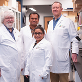 Iowa State researchers, left to right, Michael Wannemuehler, Saji Uthaman, Rizia Bardhan and Gregory Phillips in a lab in the Advanced Teaching and Research Building.