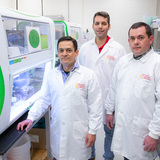ISU faculty pictured by VDL testing machine
