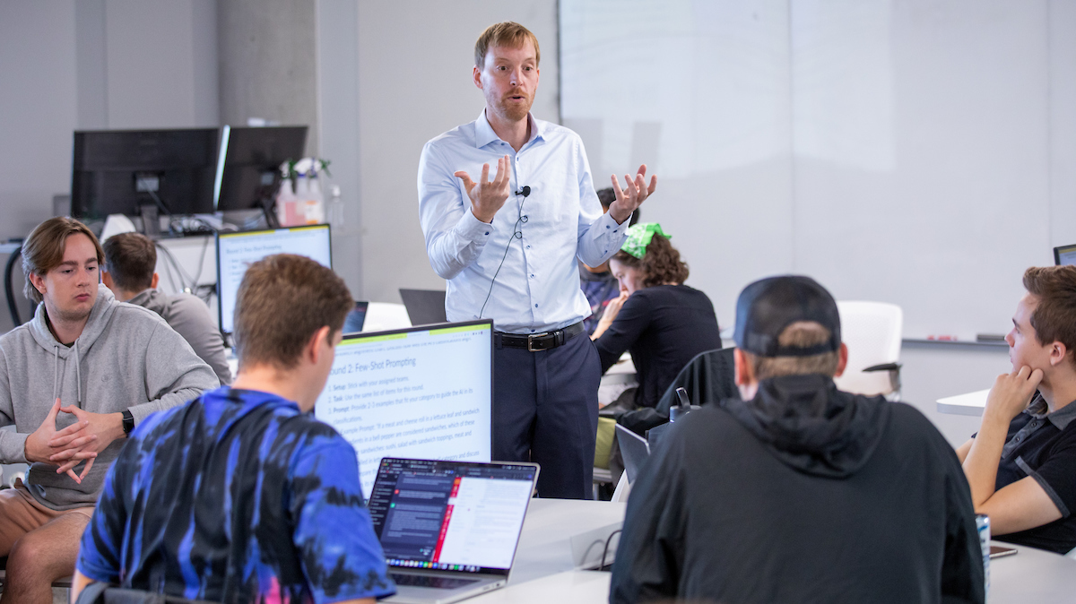 Abram Anders, associate professor of English and interim associate director of the Student Innovation Center, discusses a response from ChatGPT in the experimental course "Artificial Intelligence and Writing." Christopher Gannon/Iowa State University.