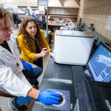 Nicole Hashemi, an associate professor of mechanical engineering, and Justin Sehlin, a graduate student, at work in the research group's laboratory.