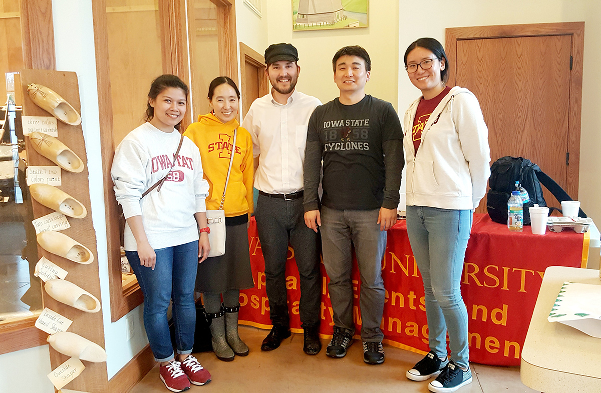 Associate professor SoJung Lee and former graduate students Zahidah Ab Latif, Heelye Park and Xingyi Zhang pose with an Orange County Tulip Festival organizer while conducting their study. Photo courtesy of SoJung Lee/Iowa State University.